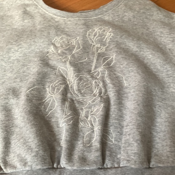 This is a Garage cropped gray sweater. With a white flower stitch design. - Picture 2 of 4